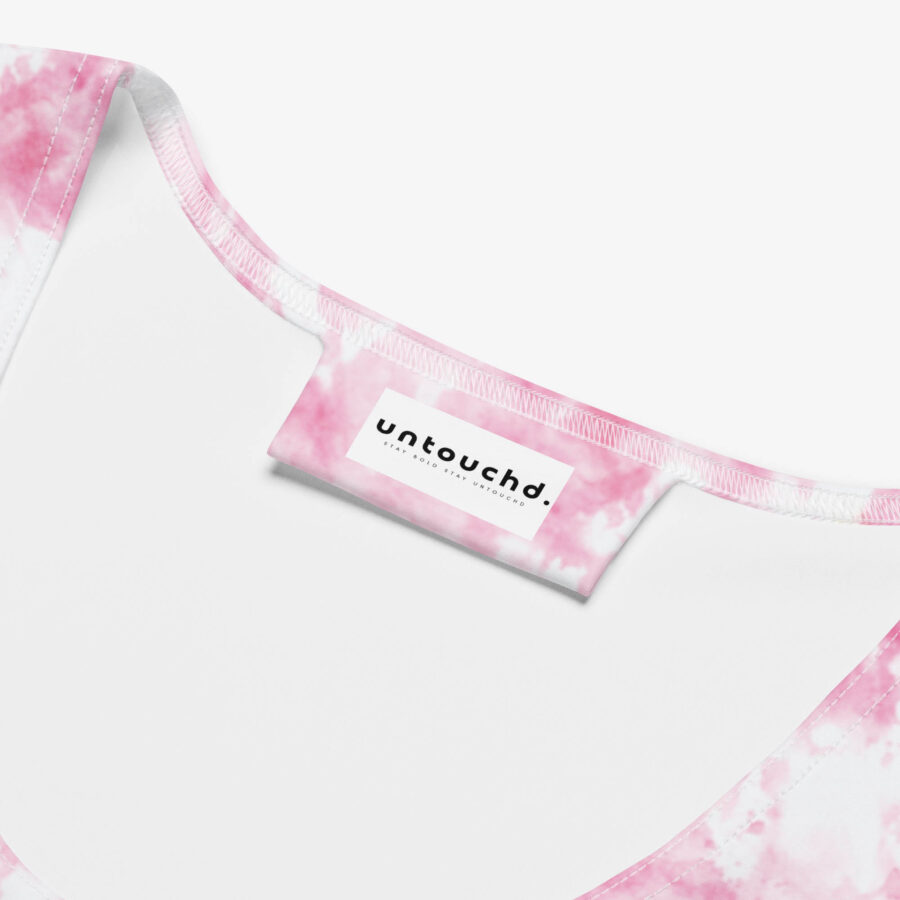 Close-up of the interior label on the Rose Blush Bodycon Dress showing the “untouchd.” branding on a pink marbled background.