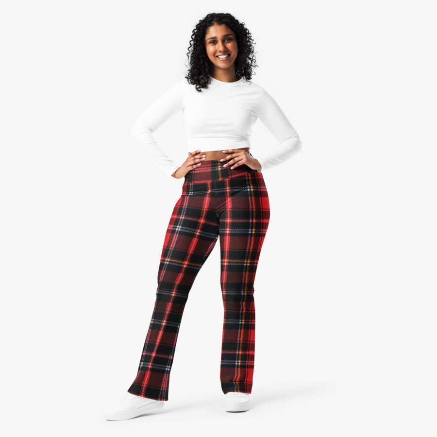 Smiling woman in Ash Red Check Flare Leggings paired with a long-sleeve white crop top and white