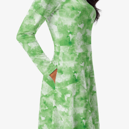 Detailed view of the side pocket on the green and white patterned midi dress, highlighting stitching and texture
