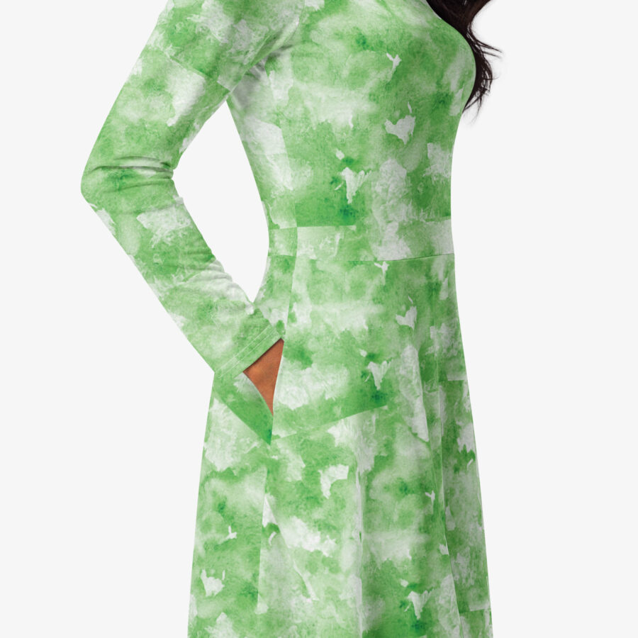Detailed view of the side pocket on the green and white patterned midi dress, highlighting stitching and texture
