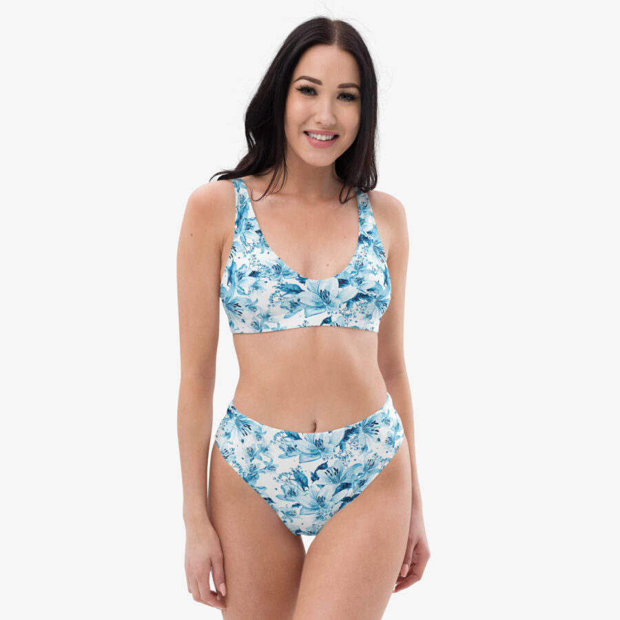Angled front-right view of a woman modeling the Azure Bloom High Waisted Bikini, showcasing its supportive fit and detailed botanical pattern.