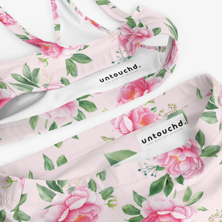 Close-up of the interior waistband and bust band of the Floral Grace High Waisted Bikini, featuring Untouchd branding and stitching details.