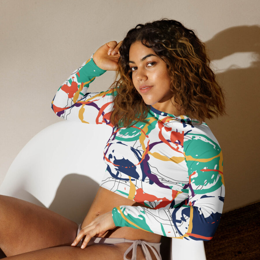 Painted Rhythm Long Sleeve Crop Top front view with sitting pose