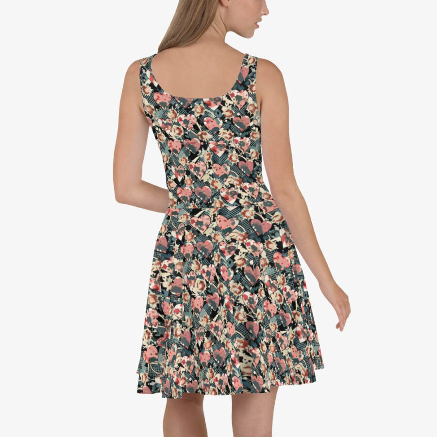 Model displaying the back of the Midnight Petal Skater Dress, designed with an abstract mix of pink hearts and grunge florals on a flared sleeveless silhouette.