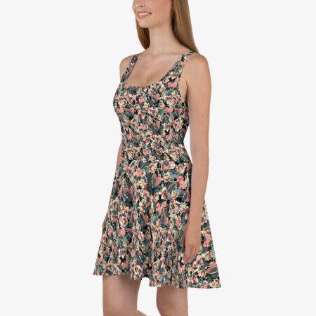 Model smiling in the Midnight Petal Skater Dress, featuring a fitted bodice, scoop neckline, and a vibrant heart-and-petal all-over print.