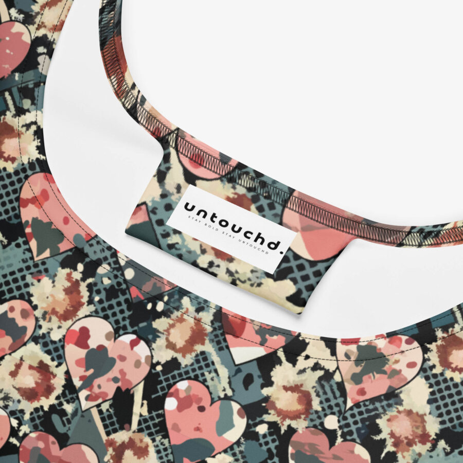 Close-up of the neckline of the Midnight Petal Skater Dress, highlighting the Untouchd label and expressive heart-print fabric.