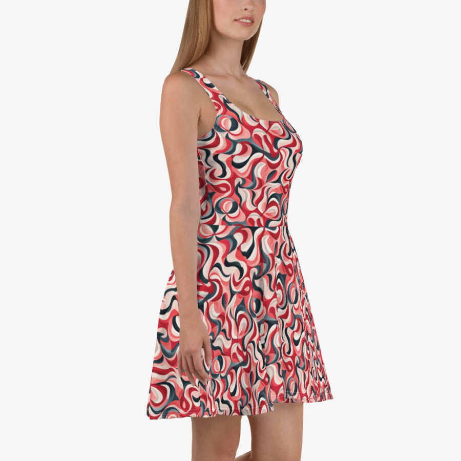 Side profile of a model in the Scarlet Wave Skater Dress, emphasizing the flattering cut and dynamic red, cream, and black swirl design.