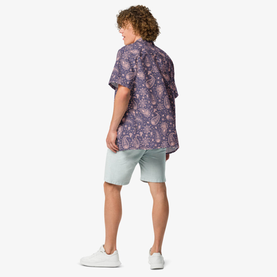 Man wearing the Paisley Bloom Button Shirt from the back, paired with light mint shorts and white sneakers on a white background.