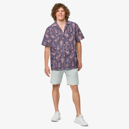 Front view of a man wearing the Paisley Bloom Button Shirt styled with light shorts and sneakers against a white backdrop.