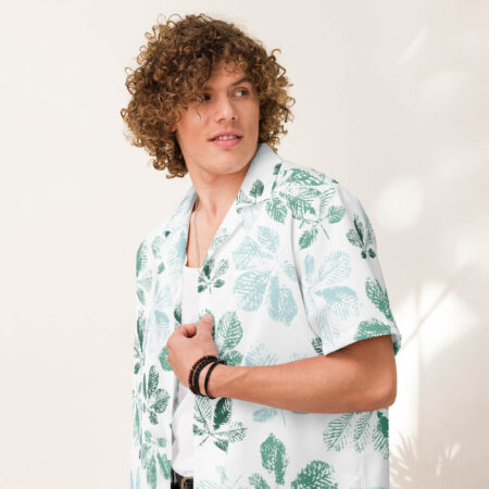 Close-up of the Mistleaf Botanical Button Shirt worn by a man, showing detailed green leaf patterns and smooth collar design.