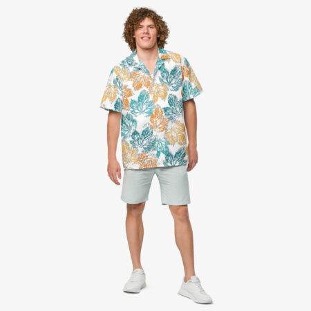 Front view of a male model smiling and wearing the Autumn Mirage Button Shirt with light shorts, highlighting the colorful fall-inspired print and casual silhouette.