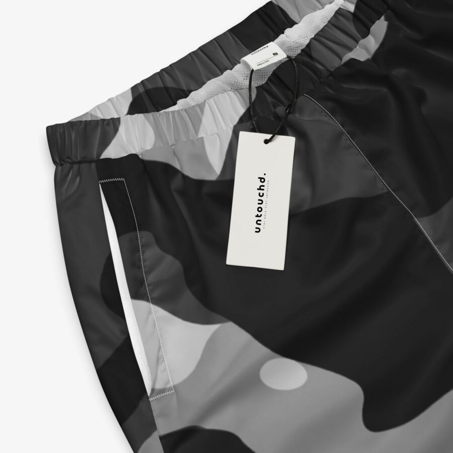 The phantom drift camo track pants fuse grayscale camo with utility details and breathable comfort, crafted for movement and everyday edge. brand view