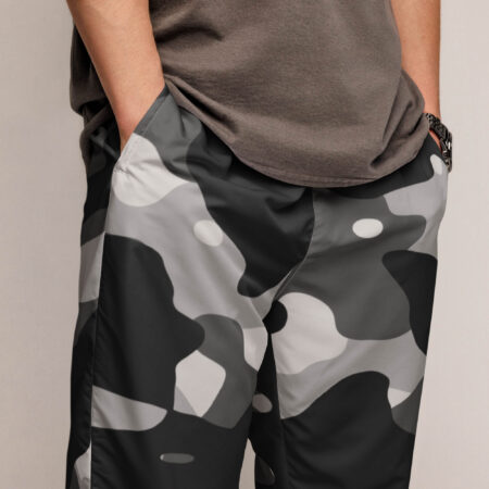The phantom drift camo track pants fuse grayscale camo with utility details and breathable comfort, crafted for movement and everyday edge. close-up